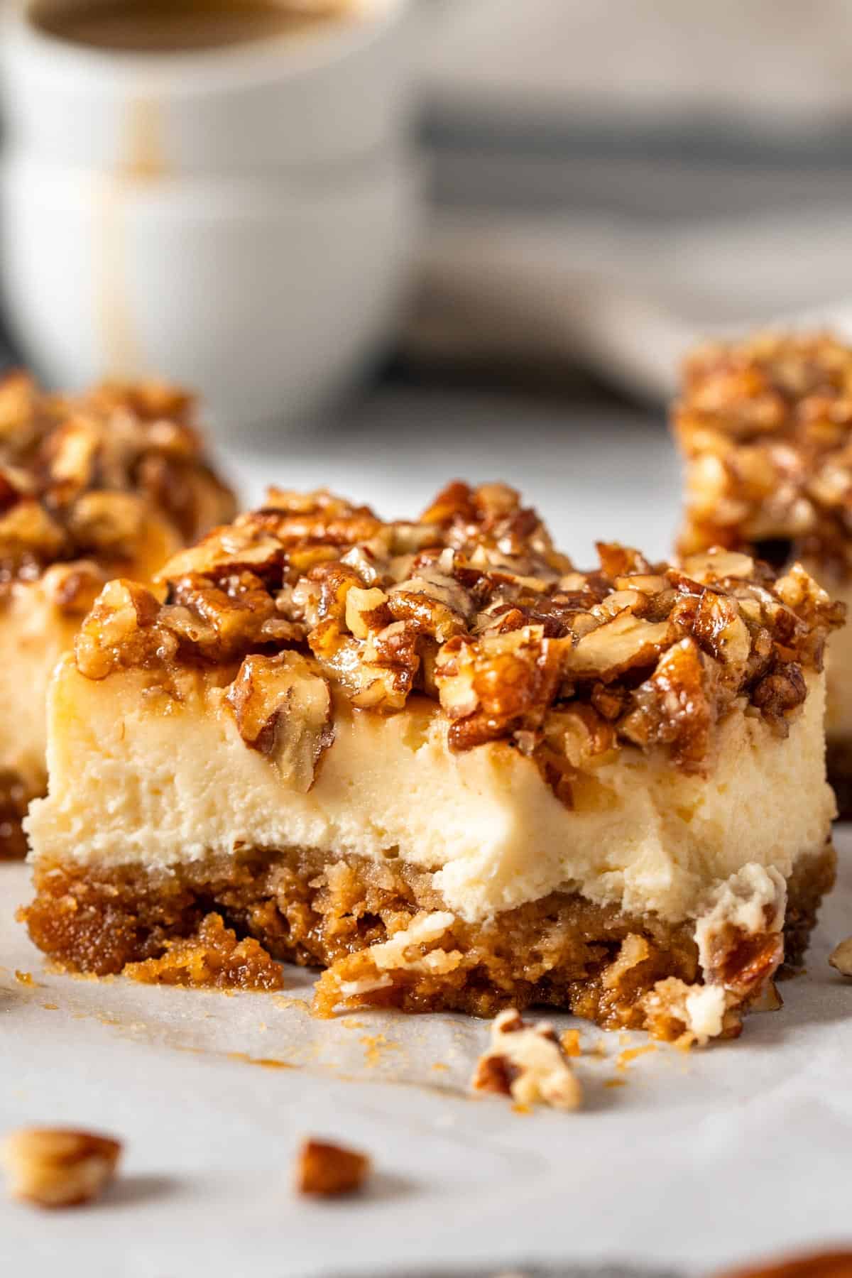 A half eaten cheesecake bar showing its creamy texture.