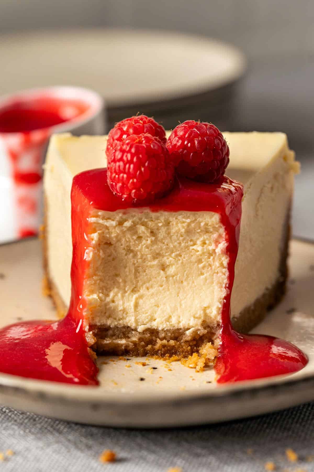 Half eaten cheesecake showing creamy texture.