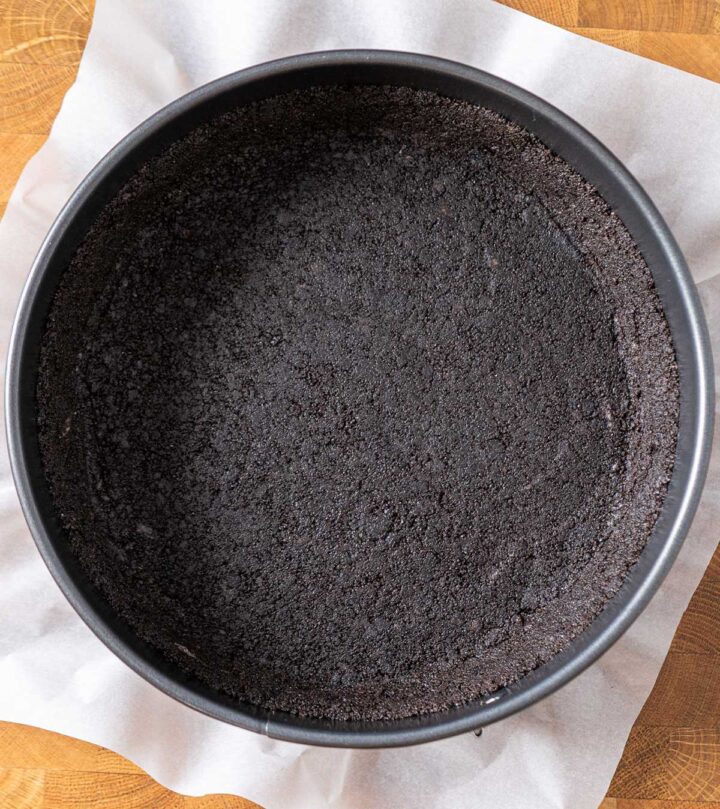 Making the crust using Oreo cookies.
