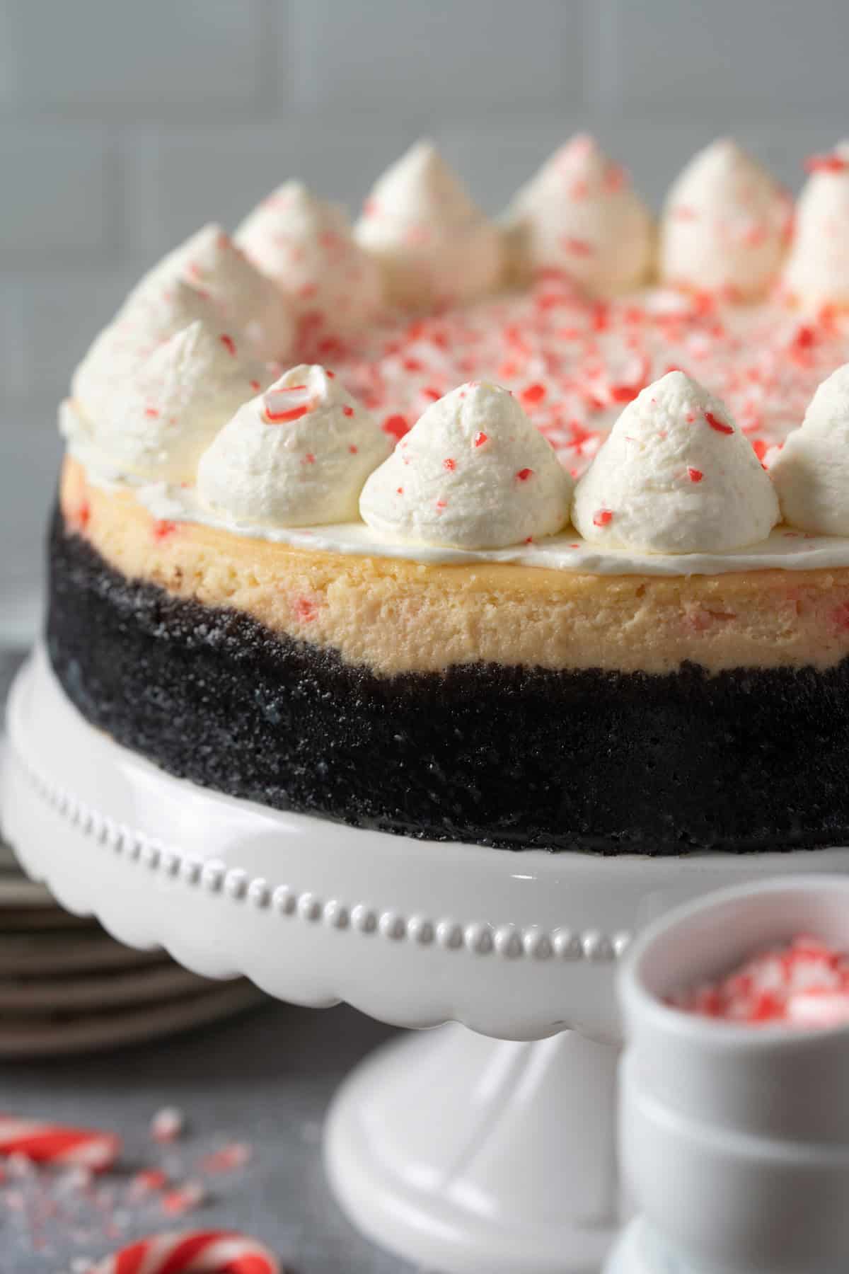 Peppermint cheesecake on a cake stand.
