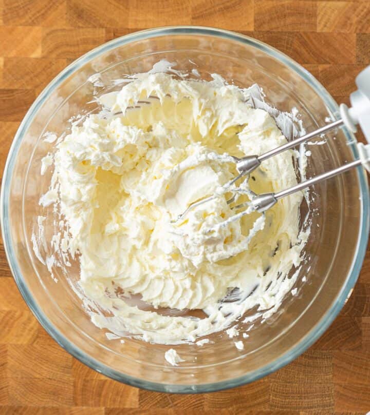 Beating cream cheese until creamy.