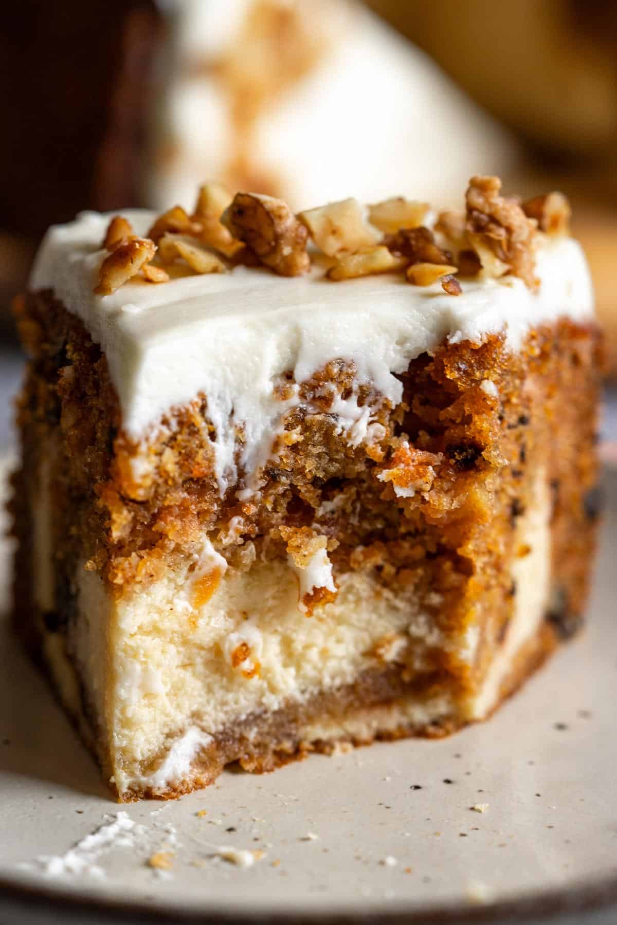 Half eaten cake on a plate.