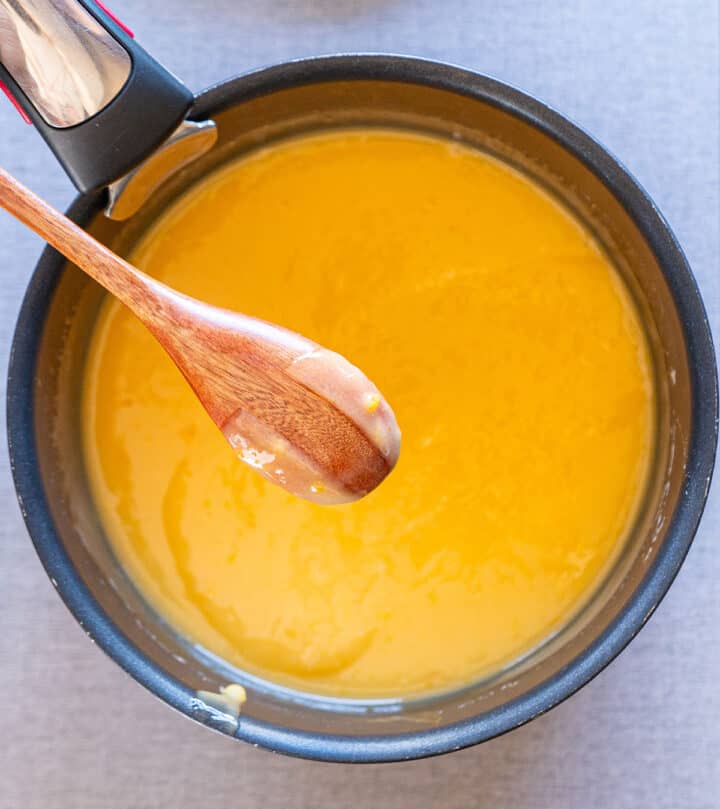 Lemon filling covering the back of a spoon.