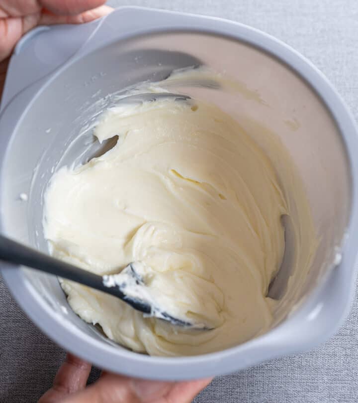 Making cream cheese frosting.