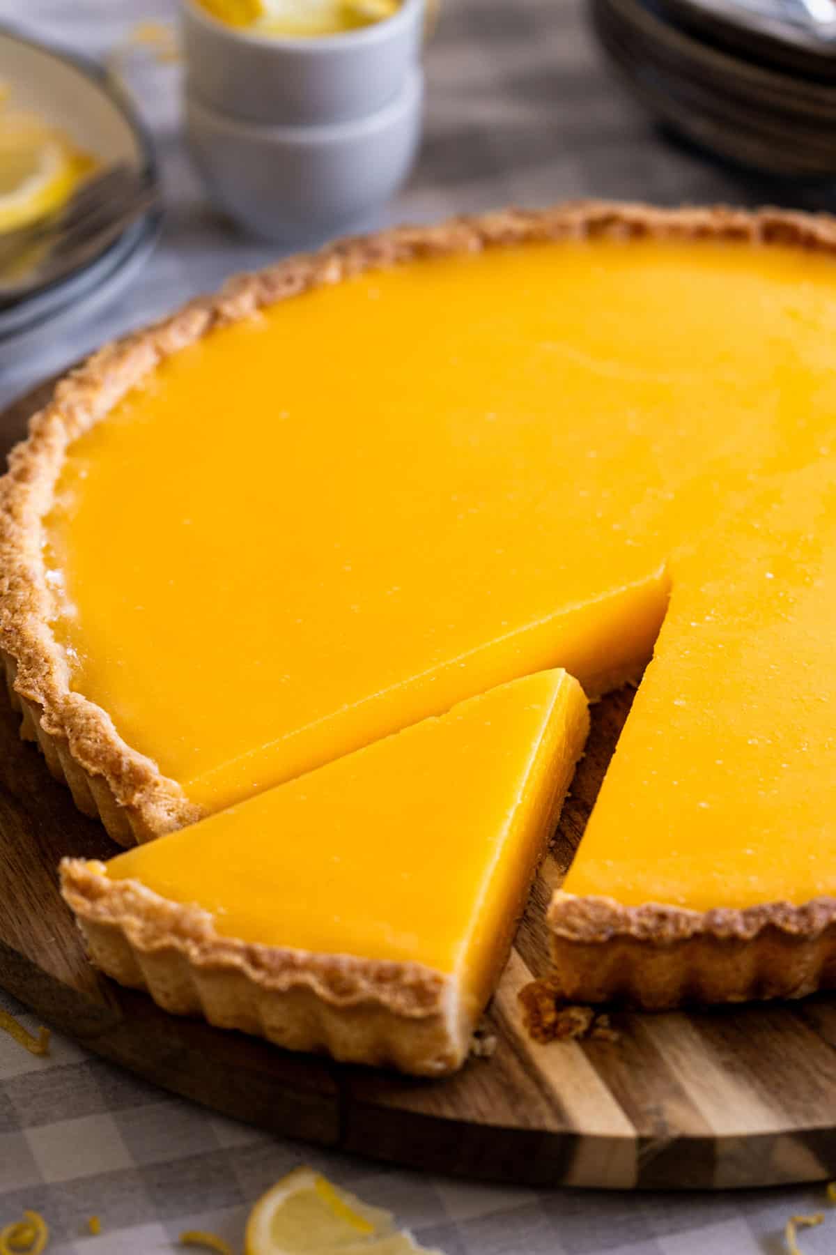 The best lemon tart recipe served on a plate.