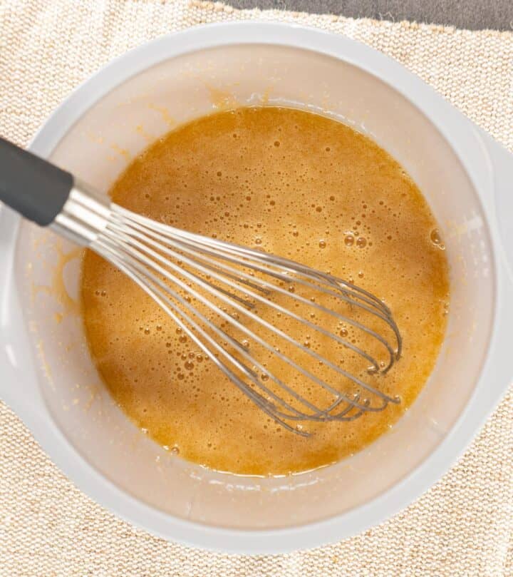 Mixing wet ingredients for carrot cake batter.