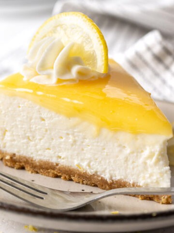 A slice of no bake lemon cheesecake on a plate.