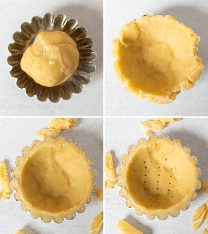 Pressing dough into a tart mold.