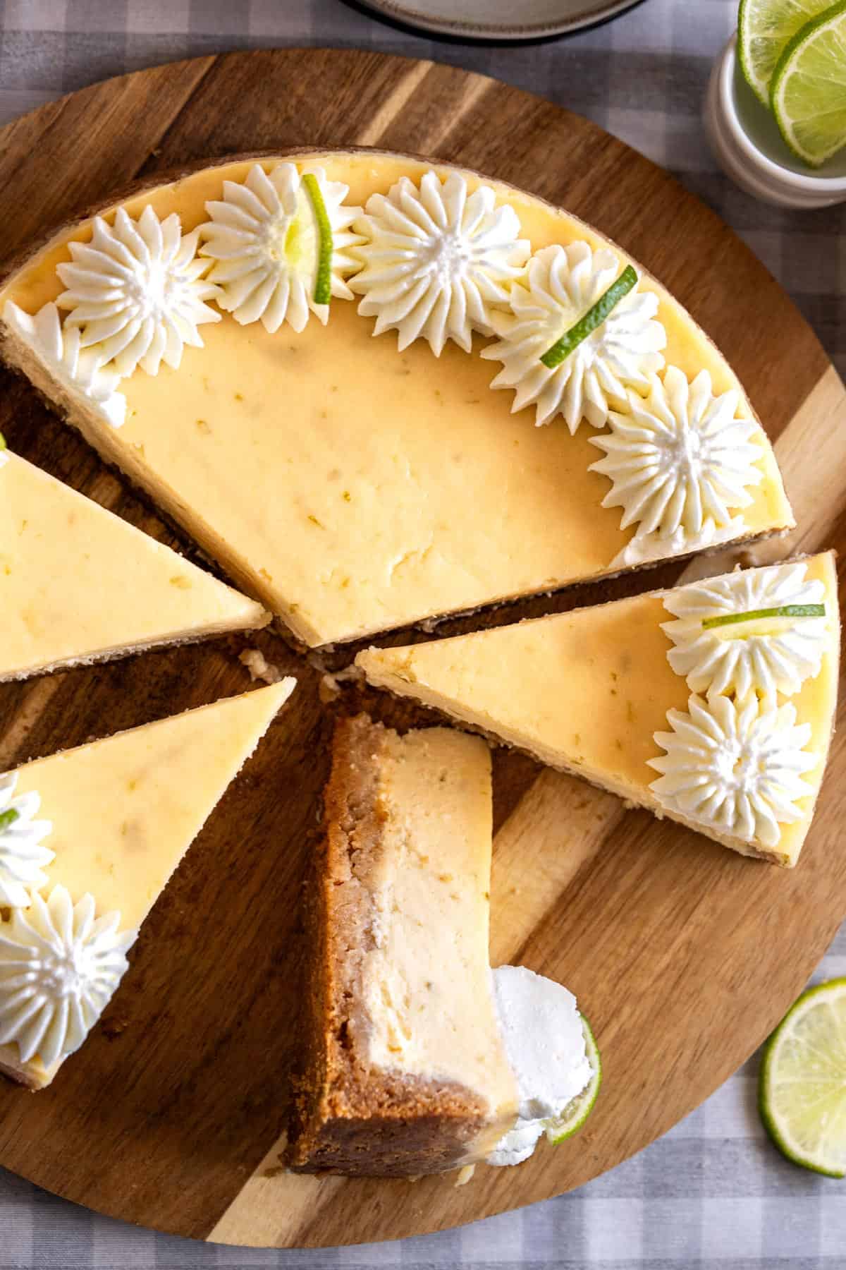 Sliced cheesecake on a serving plate.