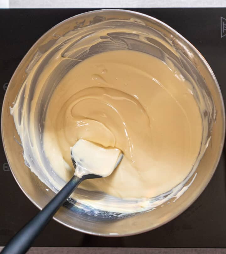 Melting white chocolate gently.