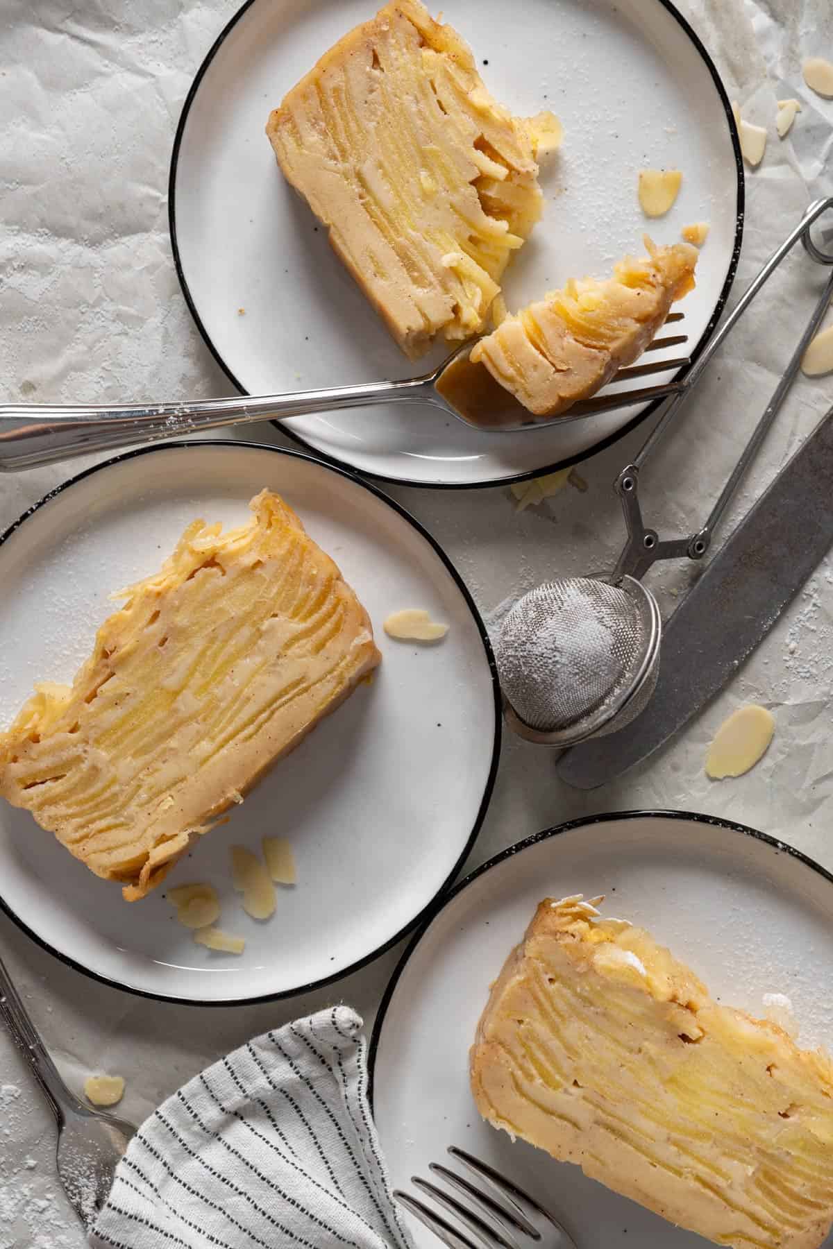 Sliced cake served on plates.