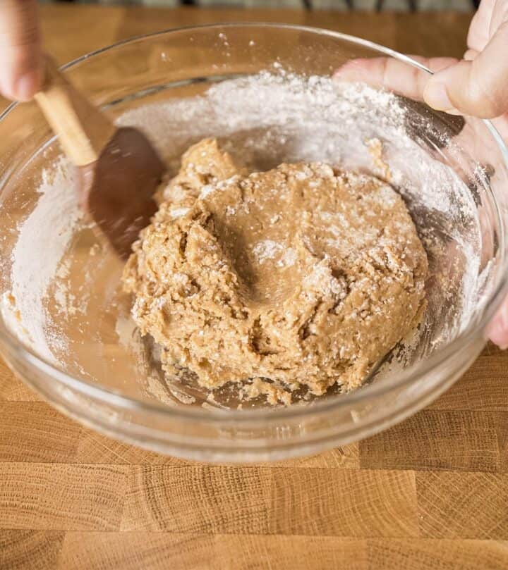 Adding flour to form a dough.