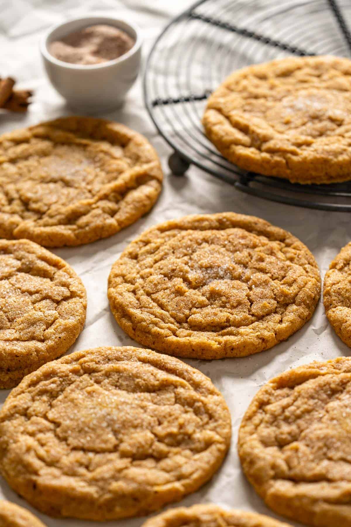 Pumpkin cookies on a parchment paper.